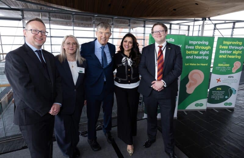 Specsavers team standing alongside host Natasha Asghar MS held an event in the Senedd, ‘Let Wales Be Heard’.